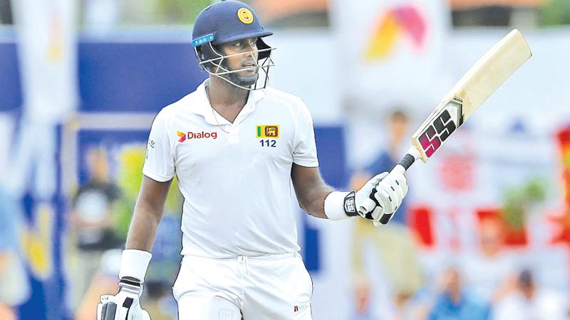 Sri Lanka’s Angelo Mathews celebrates his half century (AP Photo by Eranga Jayawardena)