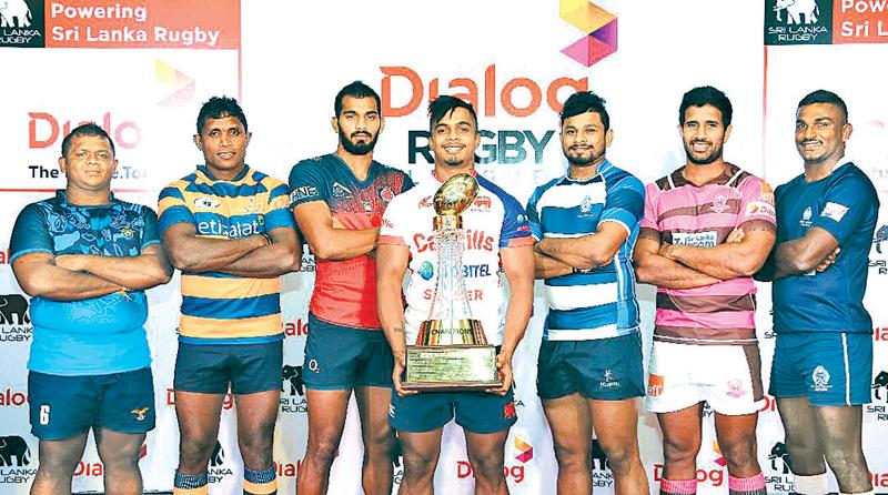 Club captains pose with the Dialog League trophy they will play for. From left:  Lahiru Udayanga (Air Force SC), Manoj Abeyratne (Army), Kavindu Perera (CR), Richard Dharmapala (Kandy SC), Thilina Weerasinghe (Navy SC), Niroshan Fernando (Havelocks) and Chanaka Suriyapperuma (Police). Absent: Yoshitha Rajapaksa (CH Captain) Picture by Rukmal Gamage    