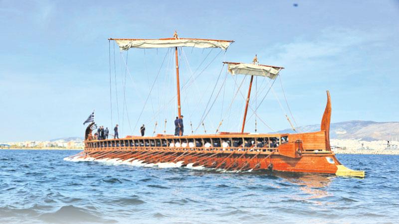 Ancient ship with oars and sails