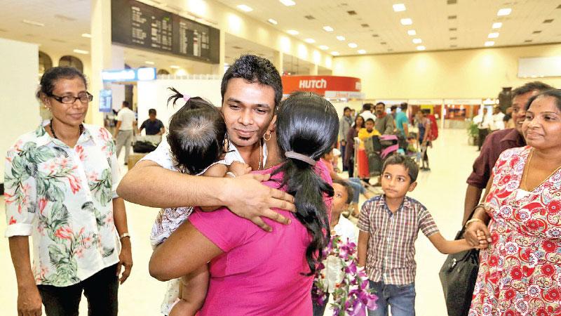 Lahiru Madushanka is being greeted by his family on arrival at the BIA