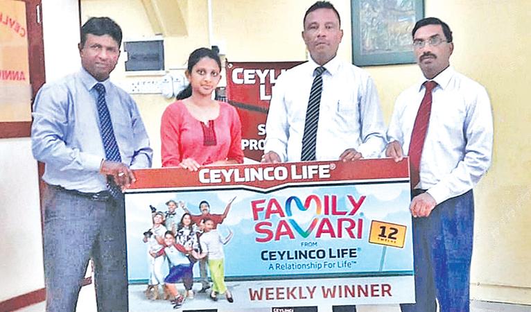Ceylinco Life Family Savari weekly winner S. Mathushana of Hatton (second from left) receives her prize from Ceylinco Life’s Unit Head Ajith Wijeyashantha, Zonal Manager Nazmi Abdeen and Branch Head L. Udayakumar.  