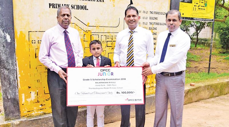 Ayodya Udan Rajapaksha of Model Primary School Thambuttegama, receives the cheque from DFCC’s Regional Manager, Candiah Jegarajah, Vice President, Liabilities and Trade Business Development, Anton Arumugam and Product Champion Nuwan Medonza.   