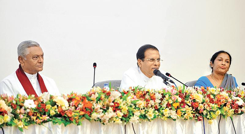 President Maithripala Sirisena addresses Health Ministry officials while parliamentarian Chamal Rajapaksa and Health Ministry SecretaryWasantha Perera look on.
