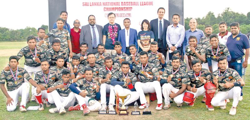 The victorious Army team pose for a picture after receiving the Champions Cup from Chief Guest ambassador Akira Sukiyama. Also in the picture are Madam Sugiyama, President of SLBF Fazil Hussain, CEO Horizon Ajith Wijesuriya and Priyantha Ekanayake (CEO SLBF)  Picture by Sulochana Gamage