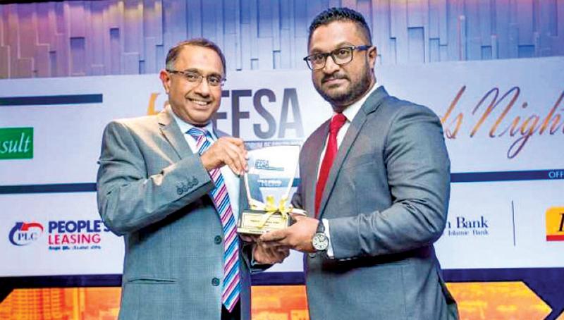 Al Safa Islamic finance unit Chief Manager Mohideen Maharoof receives the Bronze award for ‘Islamic Finance Product of the Year’.   
