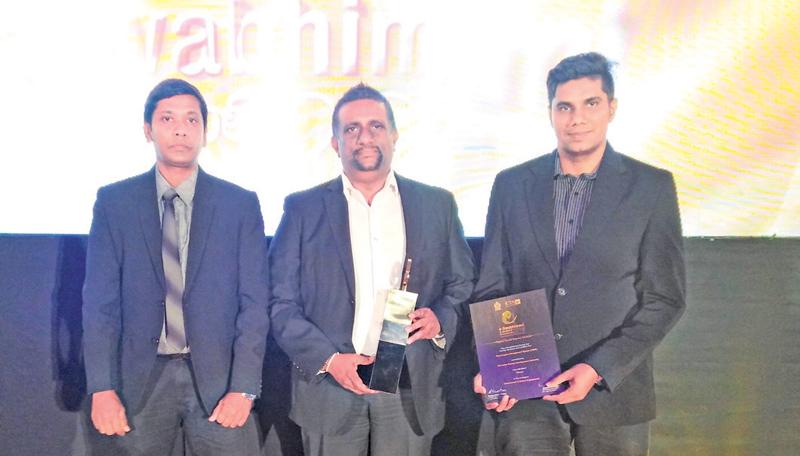  Sri Lanka Tourism officials Udana Wickremasinghe, Director ICT, Hirosh de Silva and Chandana Munasinghe with the award.