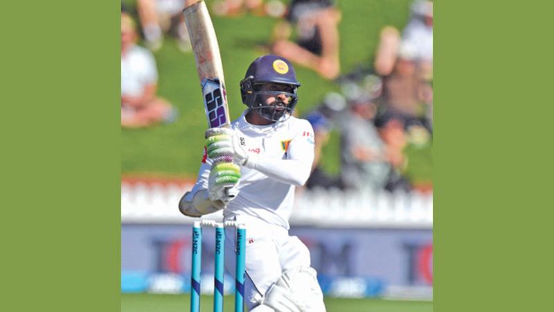 Sri Lanka’s Niroshan Dickwella plays a shot during day one of the first Test cricket match between New Zealand and Sri Lanka at the Basin Reserve (AFP)