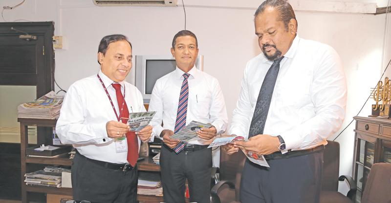 Rasanga Harischandra (right) Director Legal, Samith Kotalawala (C) DGM Corporate planning and Financial Services and Waruna Mallawarachchi (L) going through the entries at the  ANCL office (Pic by Thilak Perera)