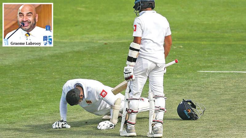 Kusal Mendis watches his former captain Angelo Mathews do dips and push-ups in a strange scenario during the concluded first cricket Test against New Zealand in Wellington     