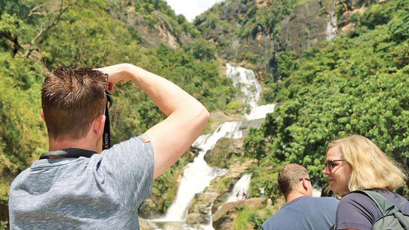 The ‘Lonely Planet’ Guide Book has nominated Sri Lanka as the top destination for 2019 and a global marketing campaign is due to be launched soon by the Sri Lanka Tourism authorities. Here tourists admire Ravana Falls on the Ella-Wellawaya road. Pic: Thilak Perera