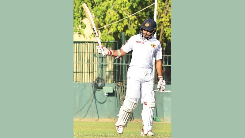 Sri Lanka A batsman Milinda Siriwardena acknowledges his half century against Ireland A at the SSC ground in Colombo yesterday 