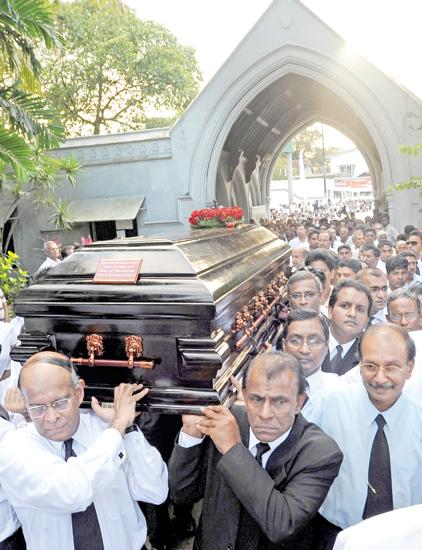 The pall bearers at Lasantha Wickrematunge’s funeral AFP