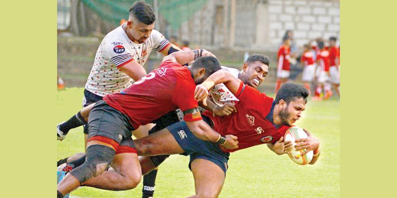 CR’s flanker Rehan Silva goes over for a try (Pic by Thilak Perera)     