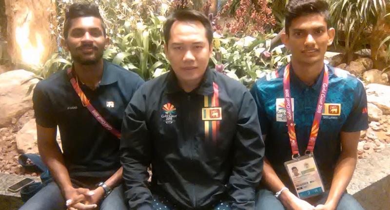 Tony Wahyudi with two promising shuttlers Sachin Dias and Buwaneka Gunatilleka