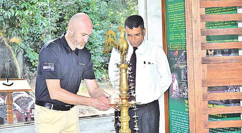 CEO of MAS Fabrics Matrix, Ivan Brown lights the oil lamp at the opening of the facility.   
