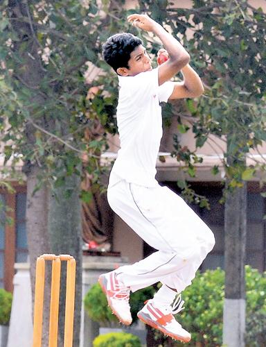 St. Joseph’s College left am spinner Salinda Seneviratne bowls against Trinity College in their match at Darley Road yesterday  (Pic by Saman Mendis)    
