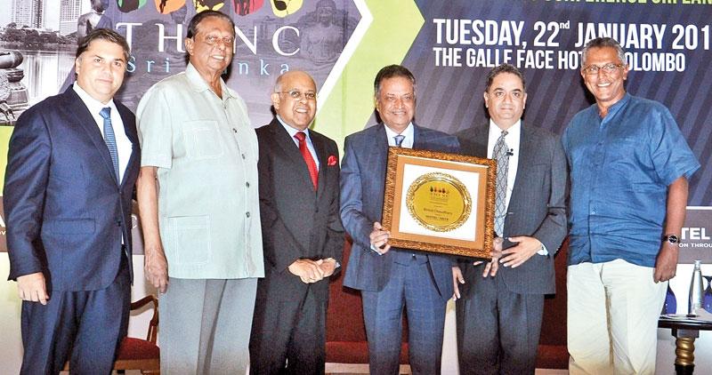 Chairman of CG Corp Global Dr Binod Chaudhary (fourth from left) with the Lifetime Achievement Award at the Hotel Investment and Networking Conference Sri Lanka. Joining the presentation party was Tourism Development, Wildlife and Christian Affairs Minister of Sri Lanka John Amaratunga (second from left) with Chaudhary’s hospitality partners in Sri Lanka, Chairman of Galle Face Hotel Group Sanjeev Gardiner, Chairman of CG Hospitality Lanka Tilka de Zoysa, HOTELiVATE Founder Chairman Manav Thadani and Chairm