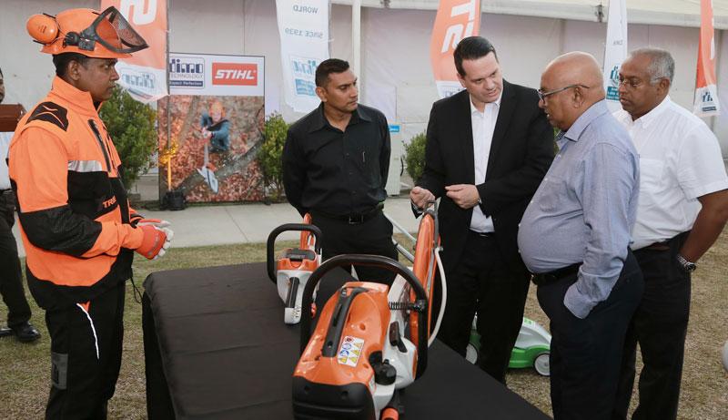 Stihl Senior Sales Manager for Middle East, India and Sri Lanka, Peter Wesner explains product features to DIMO Chairman and Managing Director Ranjith Pandithage and DIMO Group CEO Gahanath Pandithage. DIMO Assistant General Manager of Power Tools Division, Kumar Rodrigo looks on.   