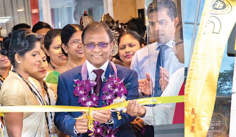 The BOC’s CEO and General Manager Senarath Bandara opens the Milagiriya branch. Deputy General Manager Retail Banking Range 1 and Range 2 - D.M.L.B. Dassanayake and Deputy General Manager Support Services W.I. Hettihewa look on.   