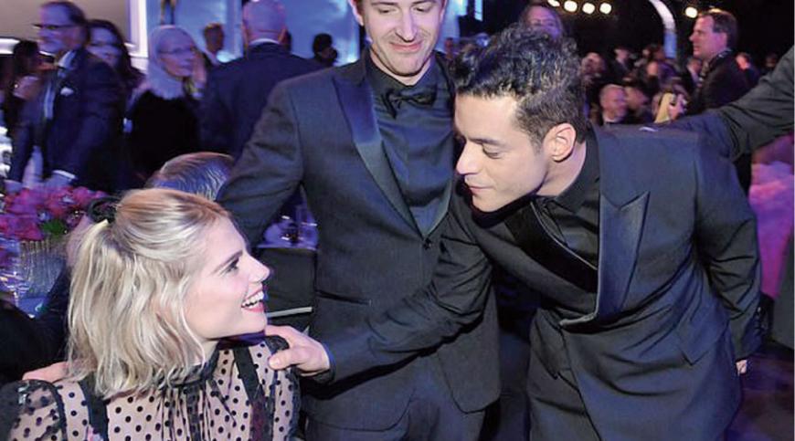  In love: Rami was ever the doting boyfriend as he tended to his girlfriend throughout the night 