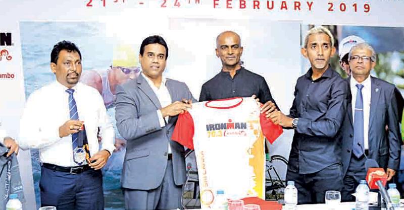 Chairman of the Sri Lanka Tourism Promotion Bureau Kishu Gomes (left) receives the official competitor’s jersey from Pro-Am and Event Director Tanjan Thananayagam in the presence of Director Pro-Am Yasas Hewage. (Picture by Samantha Weerasiri   