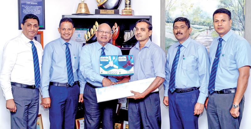 Kelani Cables PLC Director and CEO Mahinda Saranapala selling the first fan to Tecosa Electricals proprietor D.V. Prasanna Vithanage. From left: Brand Development Manager Channa Jayasinghe, Sales Manager, Electrical and Power, Rohana Wadduwage, Director/CEO, Kelani Cables, Mahinda Saranapala, proprietor of Tecosa Electricals, D.V. Prasanna Vithanage, General Manager, Marketing, Anil Munasinghe and Assistant Sales Manager, Dharshana Gamlath.   