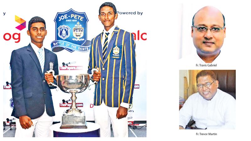 Ashain Daniel the captain of St. Joseph’s College (left) and Ranmith Jayasena the captain of St. Peter’s College hold the Fr. Maurice Legoc Cup they’ll play for     