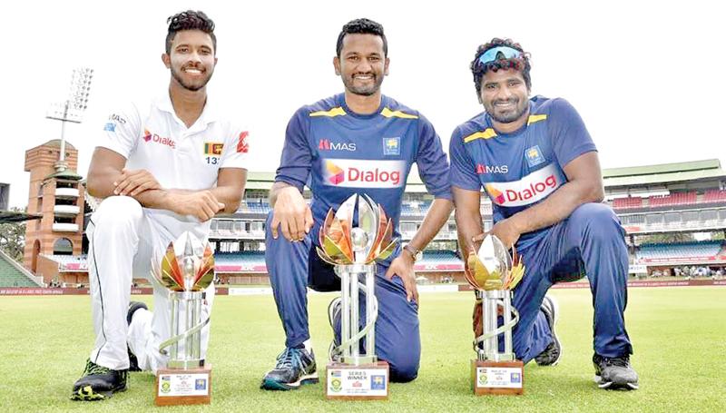 Man of the match Kusal Mendis (left), captain Dimuth Karunaratne and Kusal Perera the Man of the Series genuflect with their trophies  