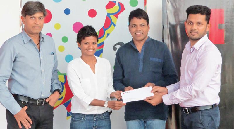 Wurth officials present the sponsorship package to Jayanthi Kuru-Utumpala and Johann Peries.