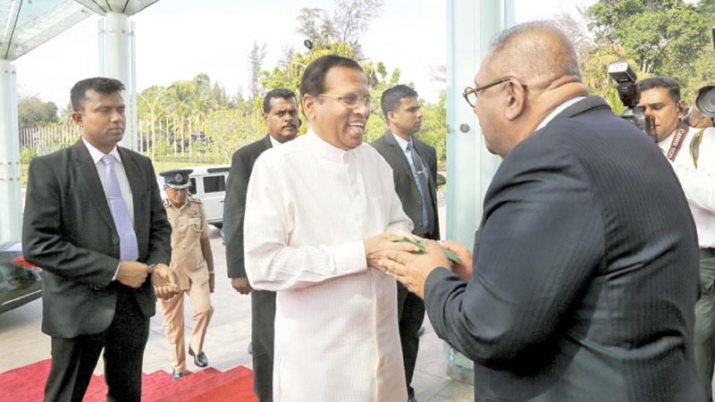 President  Maithripala Sirisena greets Mangala Samaraweera at the event 