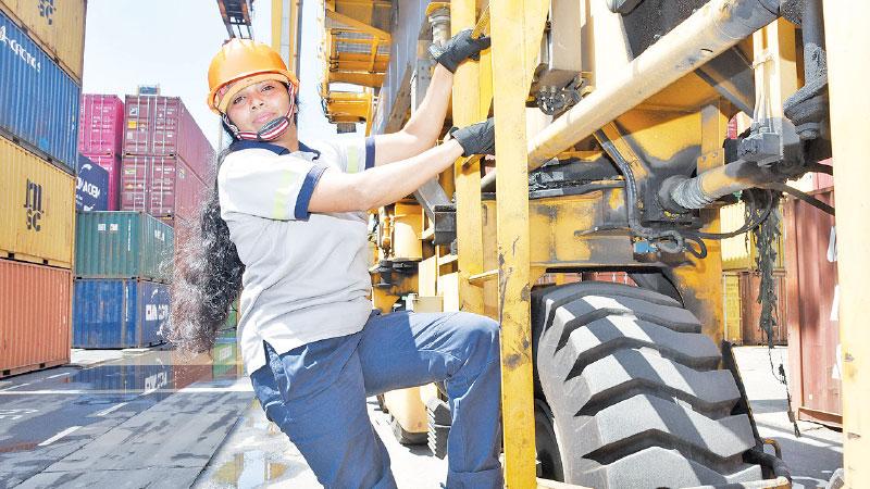 Harshani climbing her crane