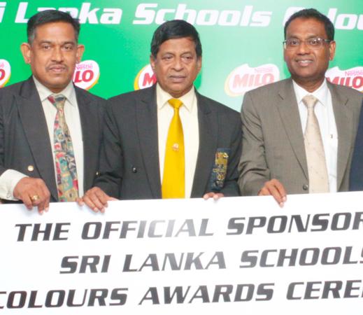 Vice President Corporate Affairs and Communication of Nestle Lanka Bandula Egodage (right) handing over the sponsorship cheque to Special Consultant Sports of the Ministry of Education Sunil Jayaweera in the presence of Athula Wijewardena the Deputy Director of Sports in the Ministry Of Education  