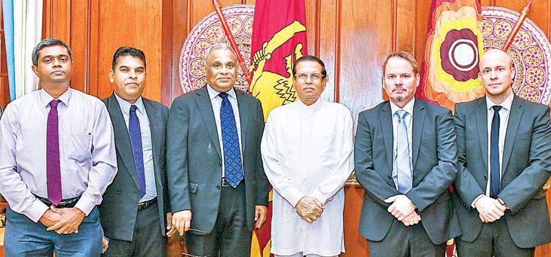 Officials of the two companies with President Maithripala Sirisena. 