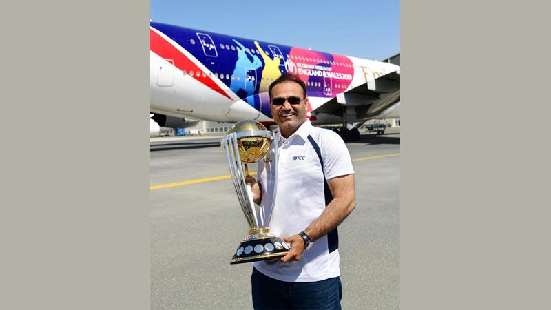 Former India cricketer and ICC Cricket World Cup 2011 winner Virender Sehwag with the trophy    