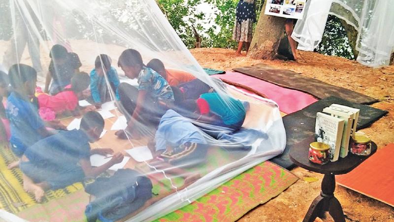 A children’s after school art class is conducted in an  installation presented by Alice Cooper  