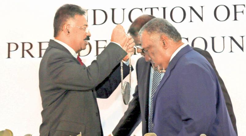 Attorney General Jayantha Jayasuriya PC, head of the official bar ceremoniously inducts new President of the Bar Association Kalinga Indatissa PC at a ceremony held last evening at Hilton Colombo. Pic by Malan Karunaratne