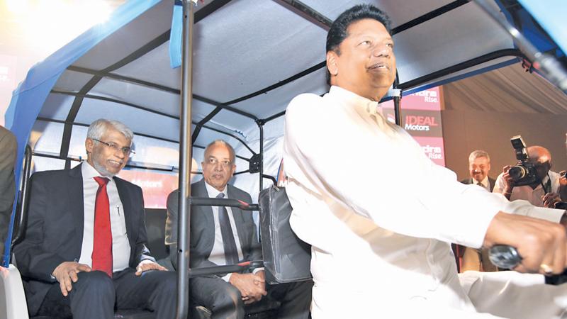 MP Kumara Welgama at the wheel while Development Strategies and International Trade Minister Malik Samarawickrema and former Chief Minister of the Eastern Province, Nazir Ahamed in the back seat of the Treo at the launch. Pic Vipula Amerasinghe