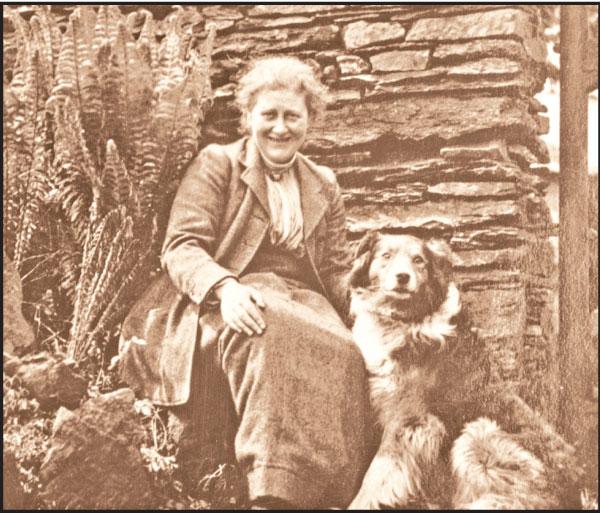 Beatrix Potter with dog Kep at the Hill top