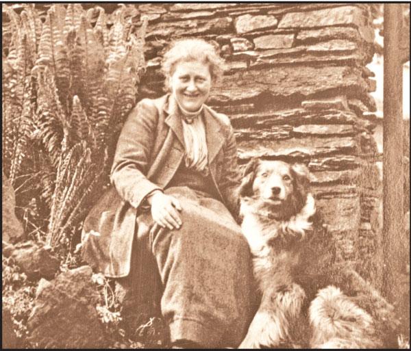 Beatrix Potter with dog Kep at the Hill top