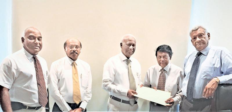 The exchange of the MoU. From left: Dr. Santush Perera, Prof. Lal Chandrasena,  Jayantha Dharmadasa, Jay Liyanage and Asoka Wickremasinghe.