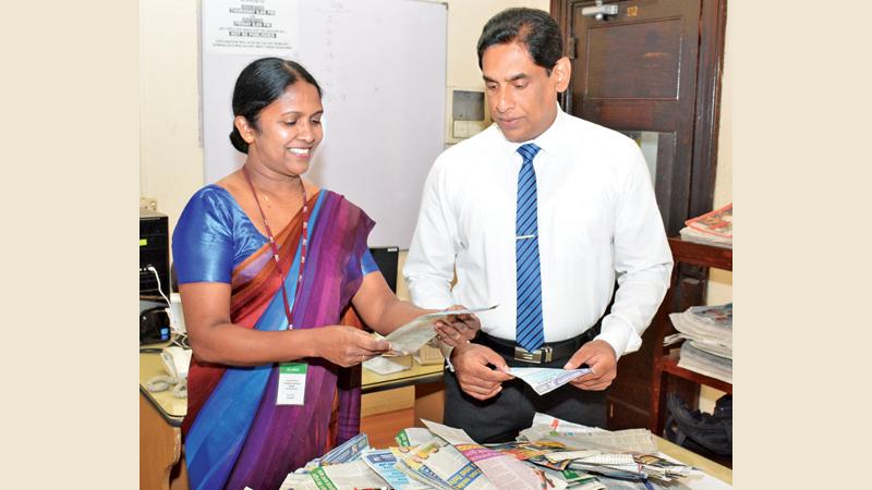 Selecting the winners of the Readers Coupon draw No. 22 of the ‘Observer School Cricketer’ by D.M. Samantha Karunasekera (right) Managing Editor Government Relations Department ANCL and Amitha Kanthilatha, Head of Human Capital. Picture by Sarath Peiris.