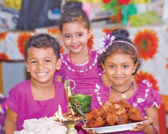 Now that the holidays are over, it’s good to reflect on what you did. Here children with Avurudu sweetmeats. Pic: Wimal Karunarathne