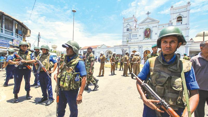 Pic caption Sri Lankan soldiers secure St. Anthony Shrine after an attack in Colombo on Sunday. At least 290 people were killed and over 450 injured in eight blasts across the country. © AP