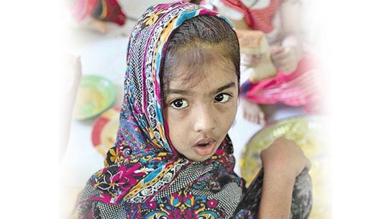 An Ahmadi Muslim refugee child at a community centre in Pasyala.