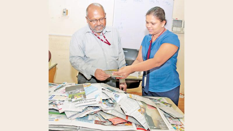 Senior Manager Financial Accounting and Tax, Gayanthi Wedage (right) and Associate Features Editor Dinamina, Anura Edirisuriya selecting the winners of the Readers Coupon draw of the Coupon No. 23 at Lake House. Pic:Shan Rabukwella