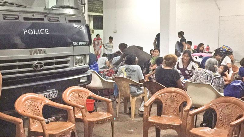 Refugees sheltering in the Negombo police garage  Pic : Ruki Fernando