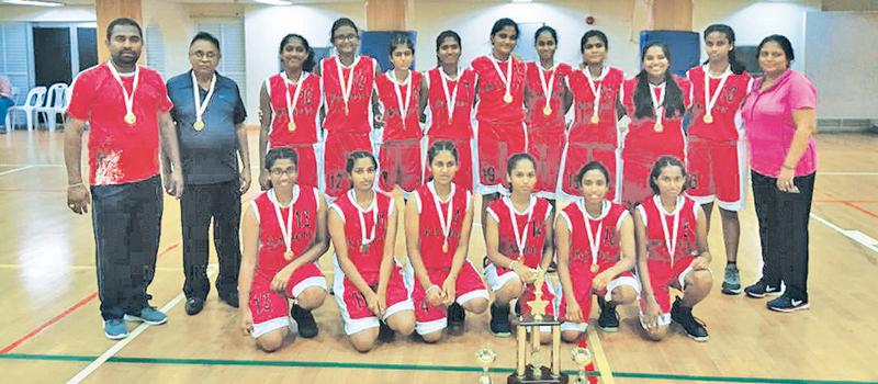 The Champion Kandy District Under 16 Girls Basketball team. Genuflecting from left: Sanjanie Kathiravel, Tharuni Kulatunge, Dinithi Chandrasekera, Shehani Egodagedara, Janithri  Lekamge, Enupama Gunawardena. Standing from left: Sajeera Gunaratne (Coach) DS Pingamage (Coach) Nadula Herath, K.Kirubakaran,Charunie Gunawardena, Koshila Weerakoon, Nimuth Lawangi, Amavi Dodanwela, Sewmini Ranaraja (Captain) Amina Fazeel, Aruni Hemakumari (Manager)