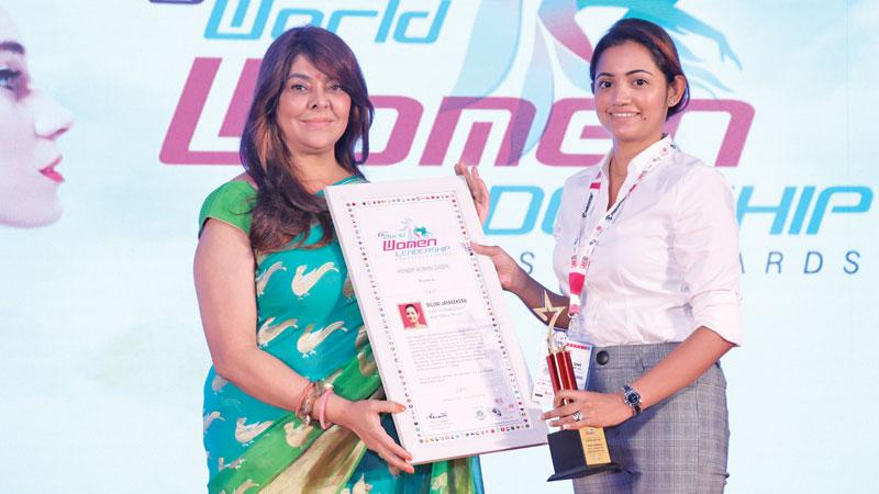 Diluni Jayasekera (on right) receives her award.   
