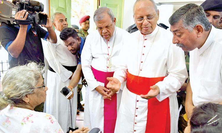 The Cardinal in conversation with a victim of the Easter Sunday attack on the Zion Church in Batticaloa.   Pic:Sivam Packiyanathan, Batticaloa Special Cor.    