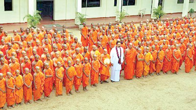 President Mahinda Rajapaksa at the Asgiriya Chapter temple in Kandy, to open a new Pirivena building on the premises in 2009 (File photo)